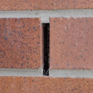 Brick wall shown with Weepa Termite Protector installed