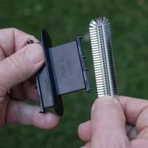 Two hands holding Weepa Protector and its installation tool